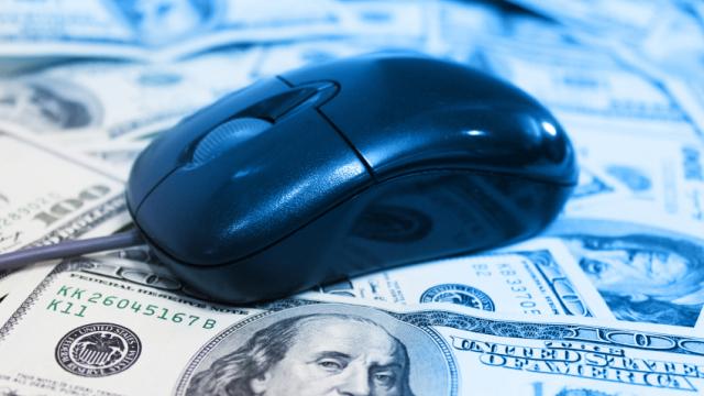 computer mouse on top of $100 bills